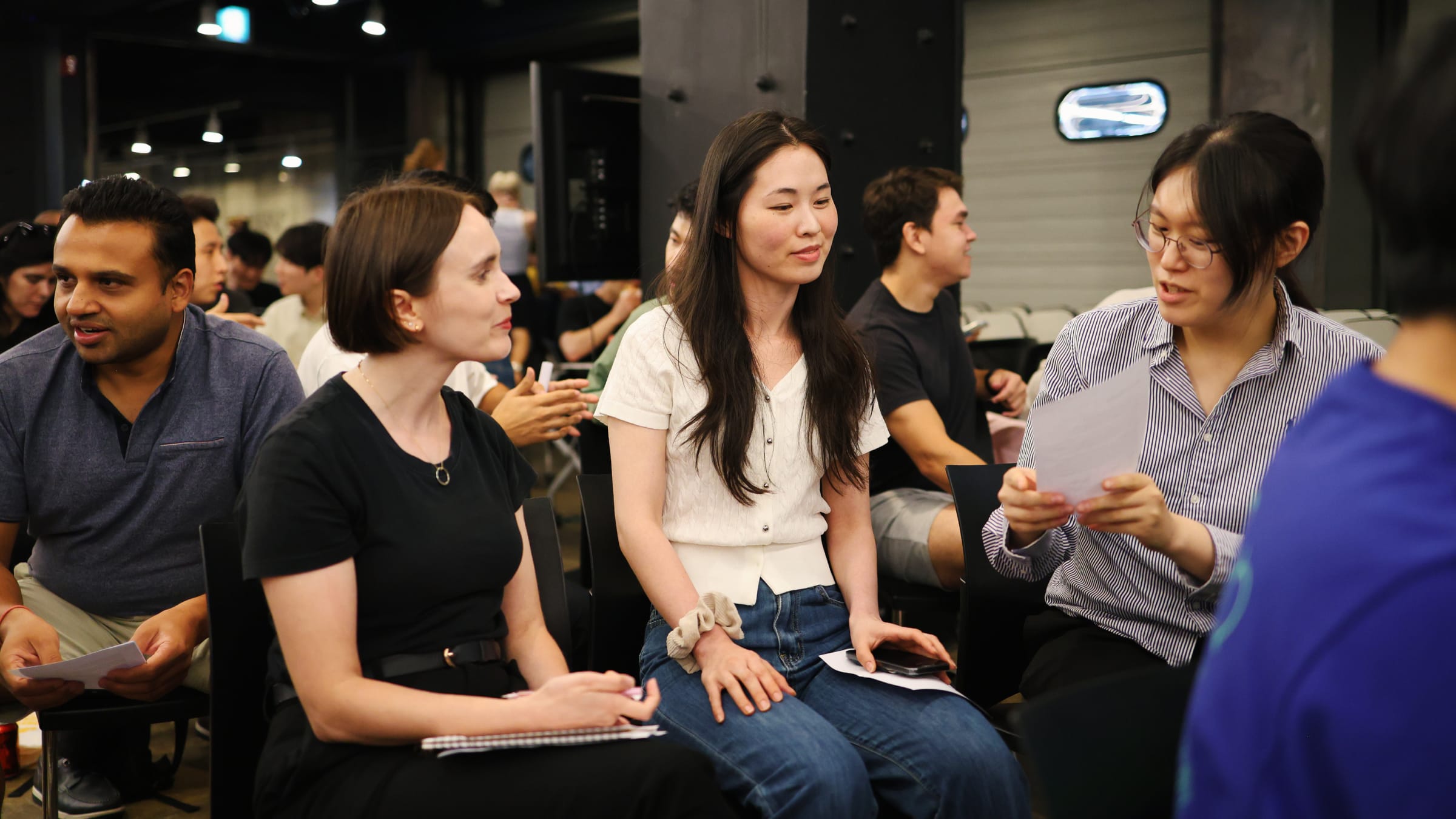 Attendees practicing in pairs